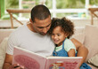 © Siphosethu/peopleimages.com - Father, girl child and reading book in home for family bonding, learning and development in lounge. Dad, kid and together on sofa for storytelling with fairytale, parent teaching for childhood growth