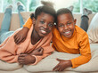 © peopleimages.com - Portrait, siblings and black children on sofa with hug for relax, trust or support in living room. Girl, young boy and embrace for bonding together, weekend break or healthy relationship in home