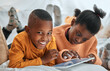 © peopleimages.com - Digital, tablet and black children on bed for education, learning or skill development in bedroom. Online, reading and kids with ebook subscription for information, literacy or knowledge in home