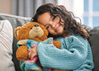© K Davis/peopleimages.com - Portrait, hug or child with teddy bear for love, comfort and toy for support, therapy healing or play. Mexican girl, orphan and stuffed animal in home with happiness, kid and donation gift for game