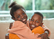 © peopleimages.com - Black kids, hug and home portrait for bonding in relationship, together and support in childhood. Children, siblings and embrace for security in connection, trust and relax in living room for love