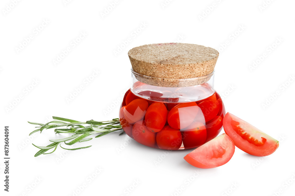 Jar of pickled tomatoes and rosemary on white background