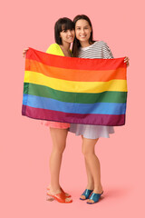 Poster - Young lesbian couple with LGBT flag on pink background