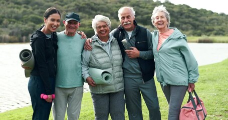 Poster - Woman, fitness coach and senior people with face, hug and happy on grass by river with exercise mat. Elderly group, support and outdoor with embrace for training, workout and wellness in retirement