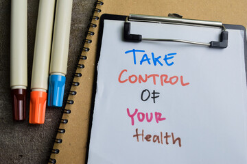 Concept of Take Control of Your Health write on paperwork isolated on wooden background.