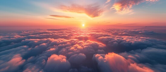 Wall Mural - The sky is filled with clouds and the sun is setting