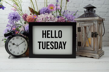 Poster - Hello Tuesday text with flowers, wooden lantern and alarm clock decoration