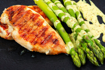 Wall Mural - Chicken fillet and asparagus.