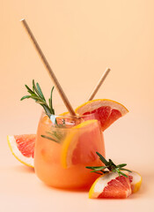 Wall Mural - Summer cocktail with grapefruit, rosemary, and ice.