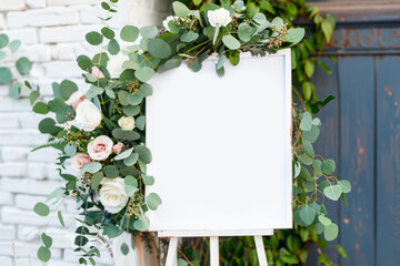 Blank Sign Decorated With Greenery and Flowers