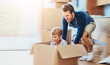 © SensSai/peopleimages.com - New home, dad or child in box for play, game or car fantasy in living room. Happy boy, father and break from moving for support, property investment or real estate opportunity for family house