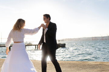 Wall Mural - Couple Dancing at Sunset by the Water