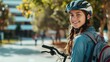 © BOONJUNG - Confident young student with backpack and helmet standing by bicycle, Copy space available for Ads.