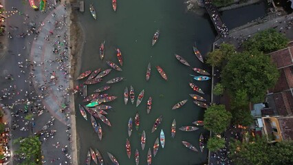 Wall Mural - Aerial view of Hoi An Ancient Town with lantern boats on Hoai river, in Hoi An, Vietnam