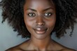 © Bijac - closeup portrait of a radiant african american woman with luminous skin and natural curly hair soft lighting enhances her features exuding confidence and beauty against a neutral backdrop