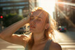 © Ekaterina Pokrovsky - Young woman suffering from extremely high temperature, heat stroke and dehydration on a street of a city. Heat waves, global warming and climate change concept.