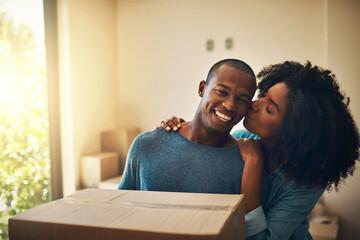 Wall Mural - New house, box and happy couple with kiss for moving, real estate or property investment in living room. Lens flare, black man and young woman with cardboard for love, mortgage or relocation in home