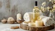 © TigerDude - Bottle of white wine with candles, soap and towels on a wooden tray over a light background in the style of a spa salon concept banner