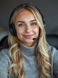 © vefimov - A woman wearing a headset and smiling at the camera