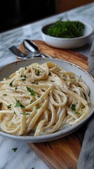 Wall Mural - Alfredo pasta dinner with creamy white sauce and herbs