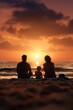 © ItziesDesign - Silhouette of a family relaxing on the beach, sitting on towels, waves gently lapping, sunset
