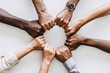 © ASyarif - Diverse hands joined together in a circle of unity and support, group of hands holding hands