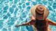 © AlfaSmart - Unrecognizable woman sunbathing next to a poolside, enjoying a sunny day