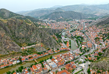 Wall Mural - Fascinating view of the city of Amasya, also known as the city of princes. wonderful clouds coming out of the mountains. YESILIRMAK river.