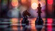 © Artyom - Chess pieces on board with blurred colorful lights in background