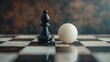 © Artyom - Black chess pawn and white ball on chessboard