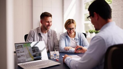 Wall Mural - Young Hispanic businessman showing house picture on laptop to happy couple