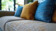 © Alena Shelkovnikova - close up of blue fabric sofa ai generated