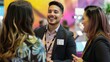 © Viktoriia - Young Man and Two Women Networking at a Conference. Generative AI