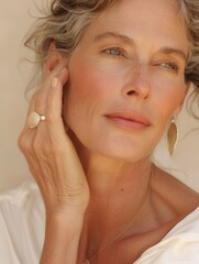 Wall Mural - Serene woman with gray hair and white blouse