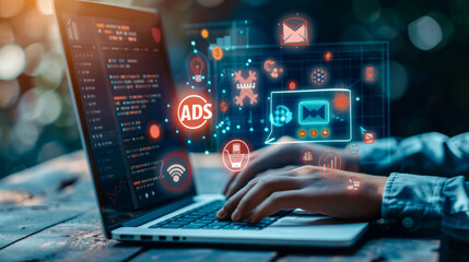 Hands coding on laptop with cyber security and digital advertising icons