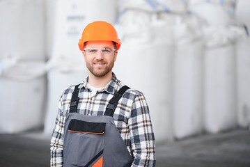 Wall Mural - Portrait of factory worker. Young handsome factory worker