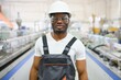 © Serhii - Portrait of industrial engineer. Smiling factory worker with hard hat standing in factory production line