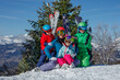 © Sergey Novikov - Family enjoys a sunny day skiing in the snowy mountains