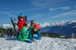 © Sergey Novikov - Happy family with kids portrait against snow peaky mountains