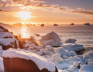 Wall Mural - A golden sunset illuminates a rugged, snowy coast with majestic icebergs floating in the distance