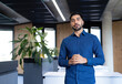 © wavebreak3 - Business professional in modern office standing and speaking confidently to camera