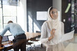 © Wavebreak Media - Presenting business strategy, woman holding paper and marker in modern office