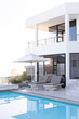 © Wavebreak Media - Modern luxury house with pool and sun loungers, perfect vacation retreat, copy space