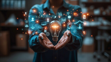Poster - Businesswoman holding light bulb surrounded by digital icons representing business innovation