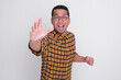 © KrishnaTedjo - A man running towards camera want to grab something gesture with amazed expression