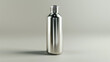 © Kashif - A classic stainless steel bottle, its surface polished and reflective, standing alone on a plain white background.