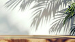 © dee-nesia - empty wooden table with palm tree shadow on the wall background summer picnic mockup for design and product display