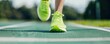 © ItziesDesign - Close-up of a person's feet in running shoes on a track, fitness and exercise, athleticism