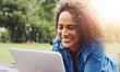 © peopleimages.com - Tablet, nature and woman relaxing on grass with smile for email on mortgage loan approval. Happy, digital technology and female person with research on finance investment online in outdoor park.