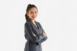 © kenchiro168 - Portrait of businesswoman smiling and posing with arms crossed, isolated on a white background.